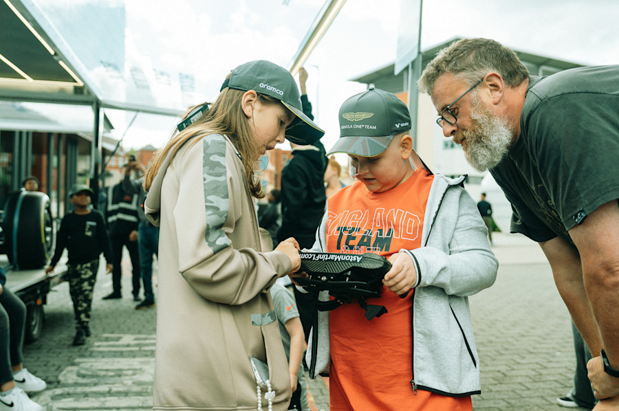 An unforgettable moment. Jozef gets his hands on the steering wheel of an Aston Martin Aramco F1 car.