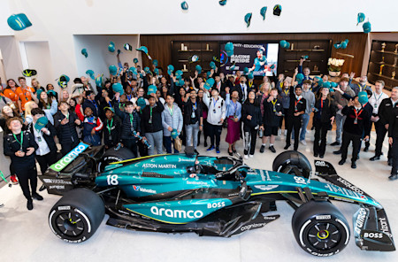 One for the photo album. Students gathered by our F1 car for a memorable photo after seeing the car up close. 