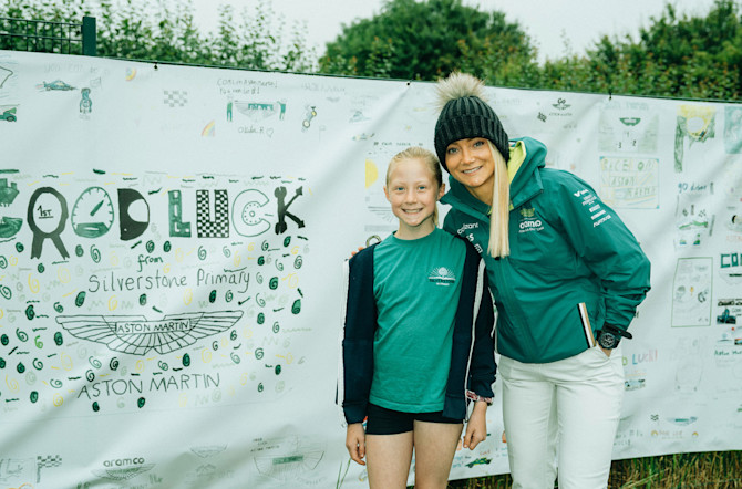 With the AMR Technology Campus just around the corner in Silverstone, the children showed their support for our team with a vibrant banner displaying images they had drawn.